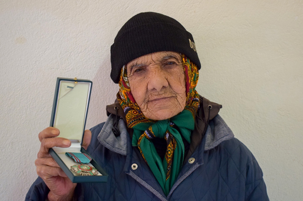 Salha el-Bouri and the insignia of the Order of the Republic of Tunisia ©SPA/RAC, Hamed Mallat